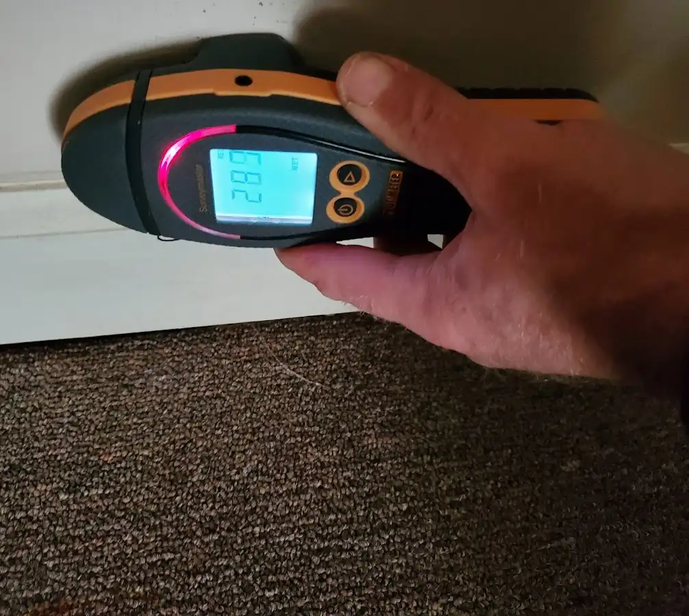 Moisture detection at baseboard during Storm Damage Restoration in Washington
